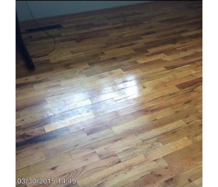 Hardwood floor with water damage from fire suppression