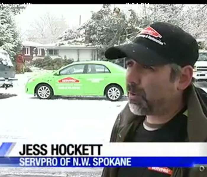 still shot from video showing SERVPRO employee speaking with homeowner