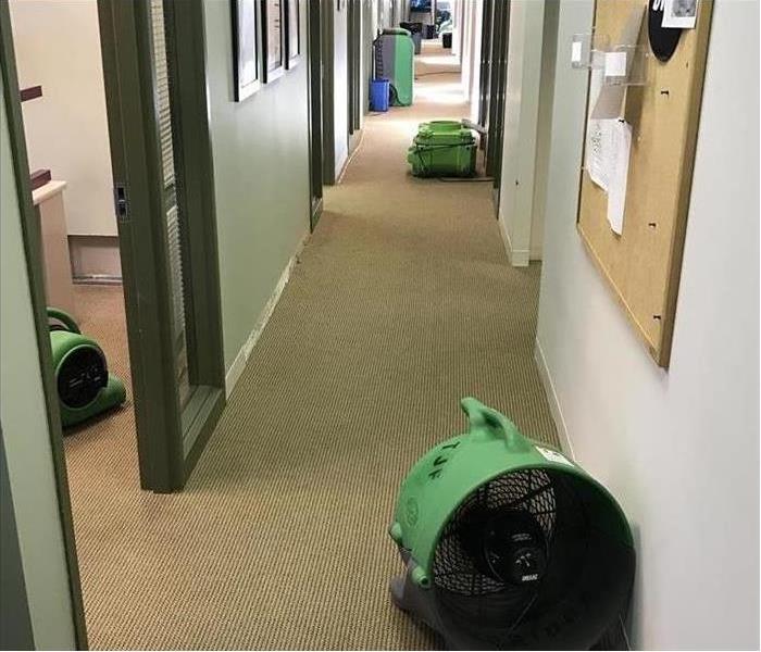 SERVPRO drying equipment in a hallway